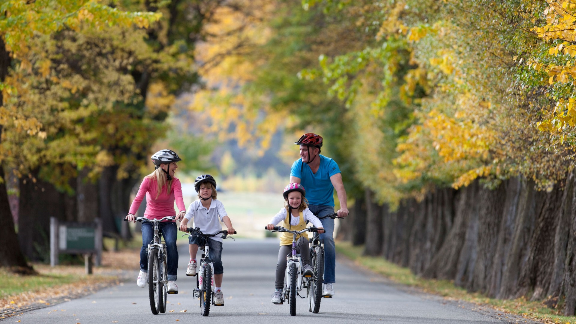 Family biking in autumn